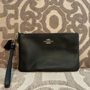 Coach wristlet- Black leather- brand new- never been used.